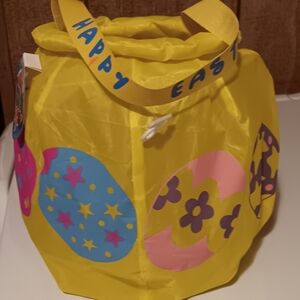 BRAND NEW!!! BRIGHT YELLOW EASTER BASKET WITH  COLORFUL EGGS DESIGNS.